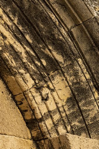 Dark Stains In Carved Sandstone Arch Segments Of Ancient Sandstone