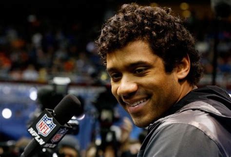 Russell Wilson explains his phenomenal hairstyle | Larry Brown Sports
