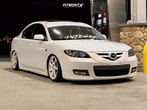 White Mazda Hatchback Modified