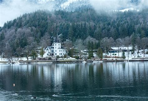 Premium Photo | Overcast winter alpine lake grundlsee view with white ...