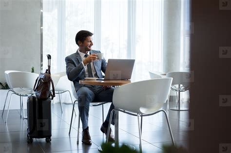 Businessman Sitting In Airport Waiting Area Stock Photo 142579