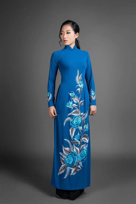 Ao dai Vietnam traditional dress. Blue silk long dress with stunning e ...