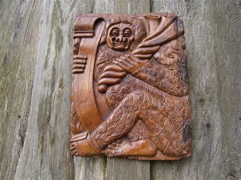 a medieval carving of a woodwose or wildman bestairy