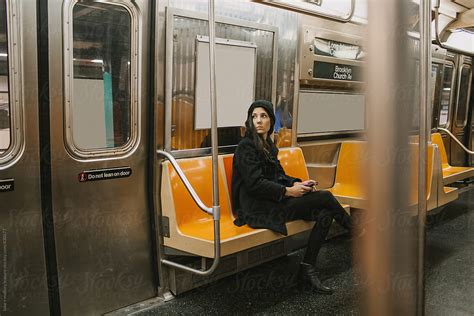 Woman Alone On Subway By Stocksy Contributor Luke Mallory Leasure