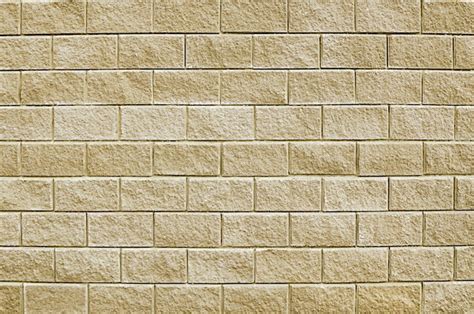 Premium Photo | Old beige stone wall background texture