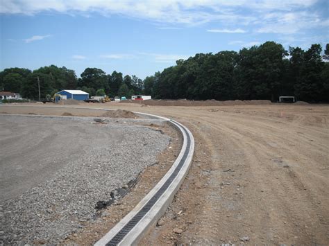 ACO Drain and Turf Anchor — Track & Field Installers