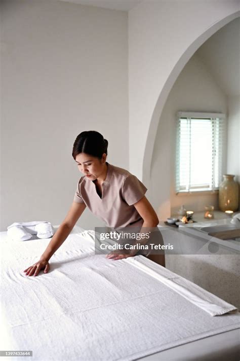 Spa Therapist Preparing A Massage Table High Res Stock Photo Getty Images