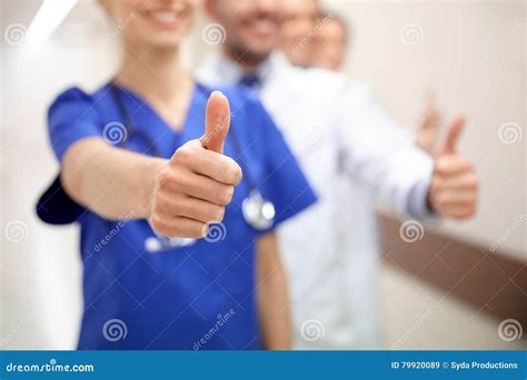 Close Up Of Doctors At Hospital Showing Thumbs Stock Image Image Of