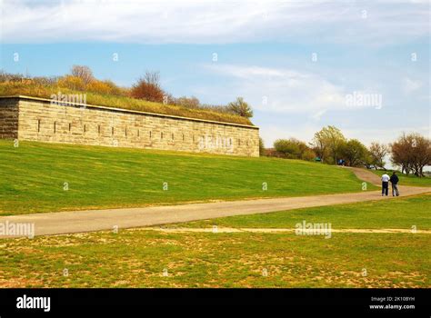 Two People Walk Around The Expansive Grounds Of Fort Warren On Georges