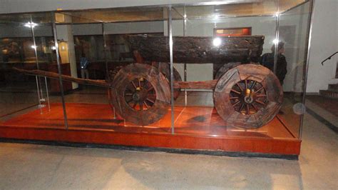 Side View Of A Hand Carved Viking Wagon Or Cart Excavated From The