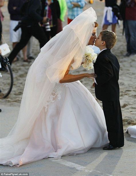 Loving: Before and after the ceremony, Angie was seen giving her son an ...