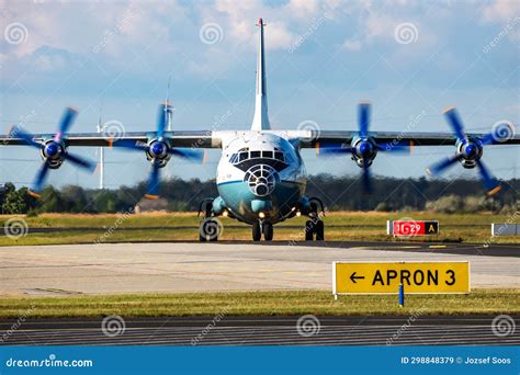 Cavok Air Antonov An 12 Cargo Plane At Airport Apron With Marshaller