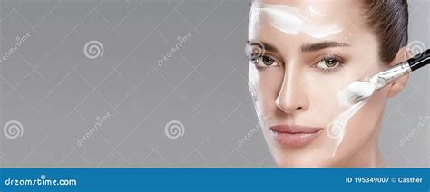 Spa Woman With Fresh Clean Skin Applying Cream On Face Cosmetology