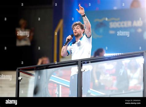 England's Tom Grennan performs at half time during Soccer Aid for ...