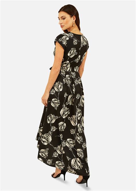 Mela Rose Print Dipped Hem Wrap Dress In Black Matalan