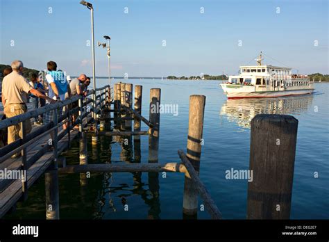 Ferry Boat Irmingard Approaching Pier With Fraueninsel In Background