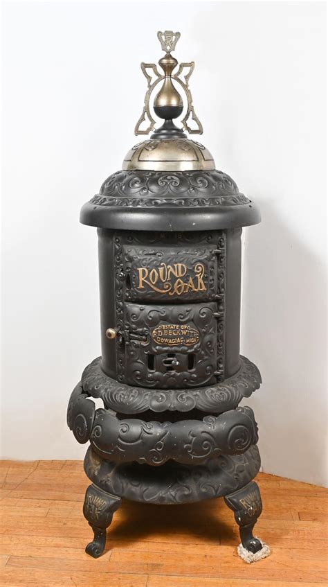 At Auction Round Oak Cast Iron Cylinder Wood Burning Stove