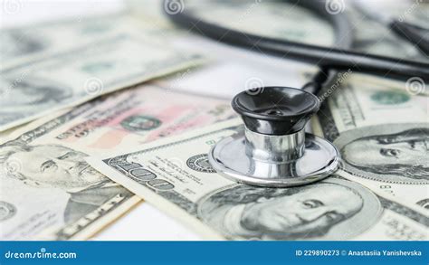 Stack Of Cash Dollars And Stethoscope The Concept Of Medical Expensive