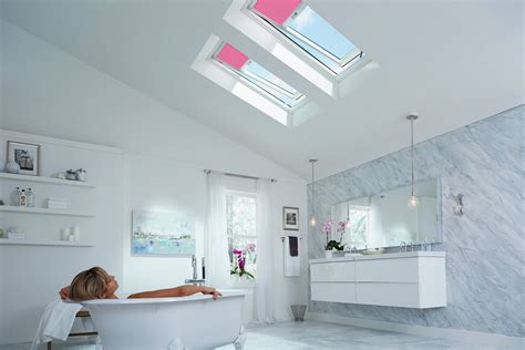 HOMEOWNERS SAVE NOW AND LATER WITH VELUX SOLAR POWERED SKYLIGHTS AND BLINDS