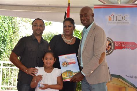 Prime Minister Dr. the Hon. Keith Rowley distributes a home package to ...