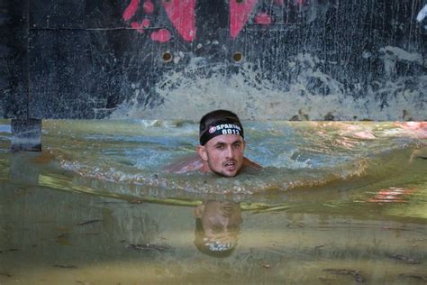 Spartan Race Runners Wade Through Mud And Leap Through Fire In Tough