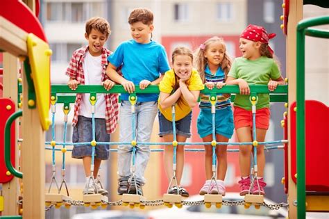 Free Photo | Happy kids playing and laughing on playground