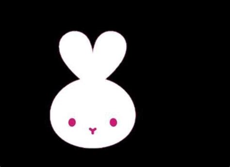 A White Rabbit Face With Red Eyes On A Black Background