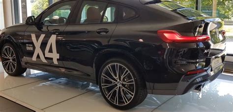 The New Bmw X4 Is On Display At An Auto Show