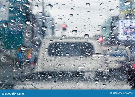 Raindrops On Windshield From Inside The Car In Traffic Jam Stock Photo