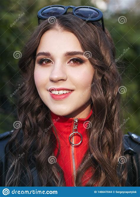 Closeup Portrait Of Young Brown Haired Curly Woman With Trendy Creative