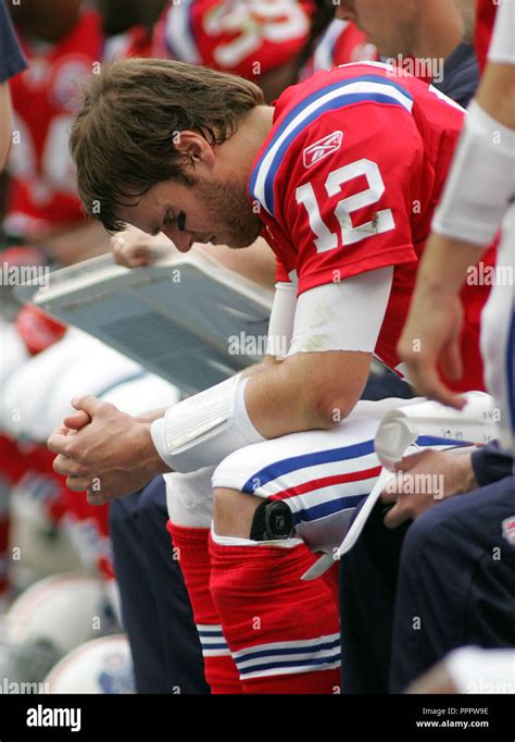 Dejected New England Patriots Quarterback Tom Brady Sits On The Bench