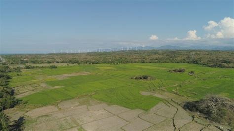 Premium Photo Solar Farm With Windmills Philippines Luzon