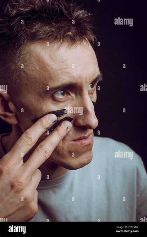 A man with military paint on his face. Declaration of war Stock Photo ...