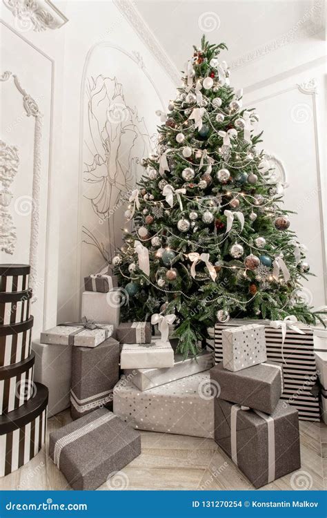 Presents And T Boxes Under Christmas Tree Boxes With Ribbon Bow