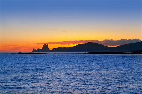 Premium Photo | Ibiza island sunset with es vedra in background