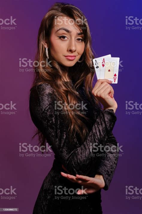 Brunette Girl In Black Velvet Dress Showing Two Playing Cards Posing