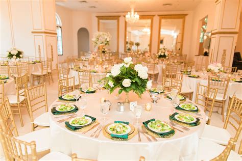 Gold and White Reception Decor With Pops of Emerald Green