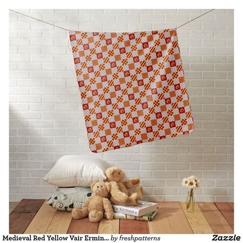 Two Teddy Bears Sitting On Pillows In Front Of A Wall Hanging From A