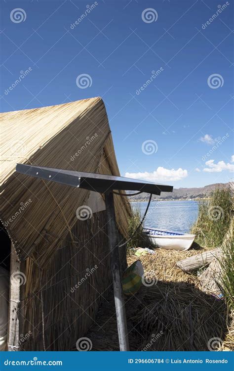 Puno Peru Traditional Totora Boat With Tourists On Lake Titicaca