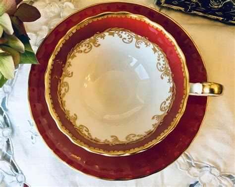 Aynsley Red And Gold Tea Cup And Saucer Oban Shape With Gold Filigree