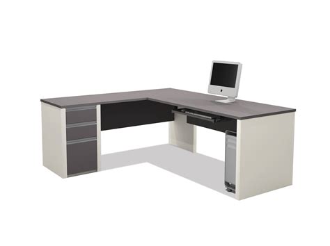 An Office Desk With A Computer Monitor And Keyboard On It In Front Of