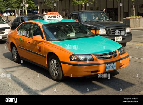 A Green And Orange Toronto Taxi Stock Photo Alamy