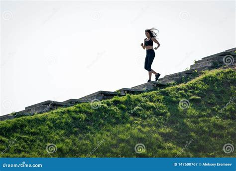 Slender Beautiful Girl With Dark Hair Runs Down The Stairs A Symbol Of