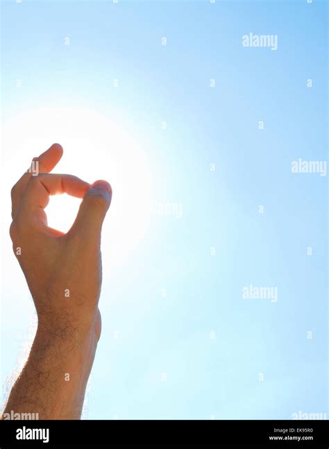 Hand Against The Blue Sky Stock Photo Alamy