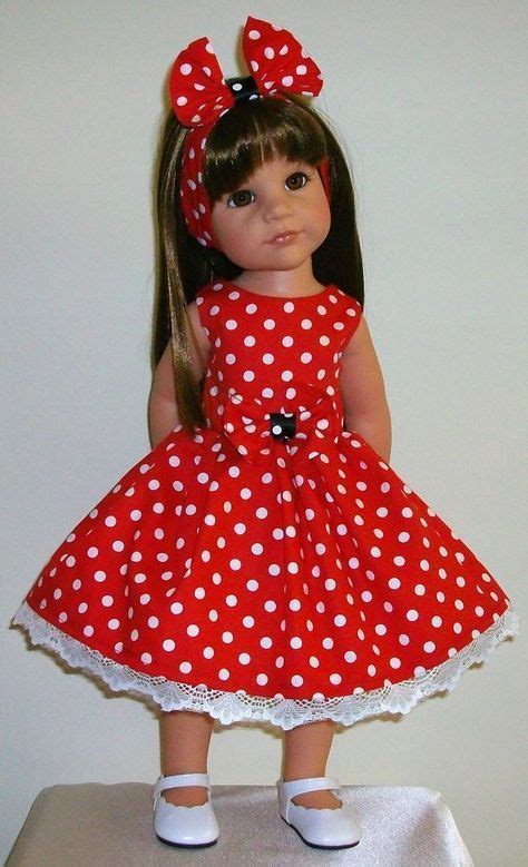 The Doll Is Wearing A Red Dress With White Polka Dots