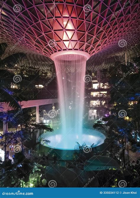 Jewel Changi Airport Indoor Waterfall Surrounded By Lush Greenery