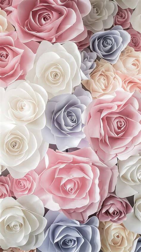 many different colored roses are arranged in the shape of a wall paper flower bouquets