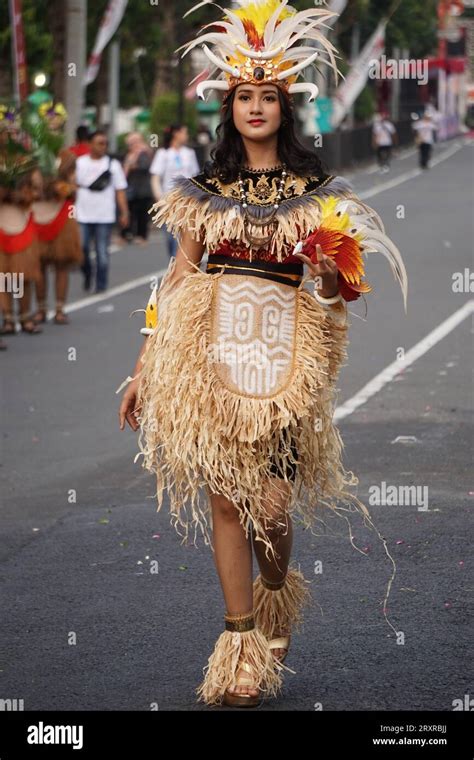 Indonesian with a traditional costume from papua at BEN Carnival Stock ...