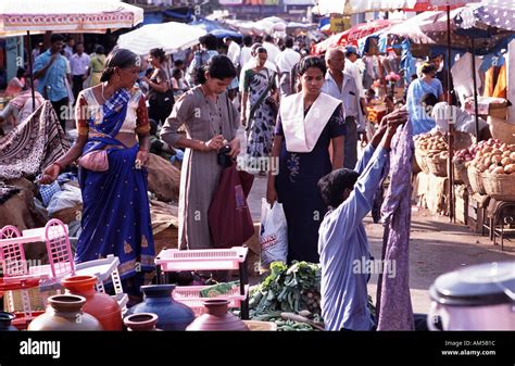 Indian Women Buy Vegetables Fruit And Cloth At The Market In Mapusa In