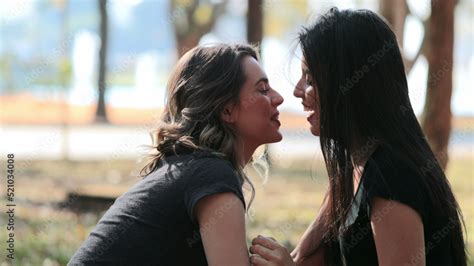 Lesbian Couple Kissing Each Lgbt Girlfriend Kisses Female Mate At The